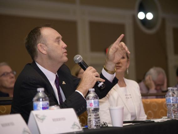 Image of Vice President Burgess asking a question at conference.