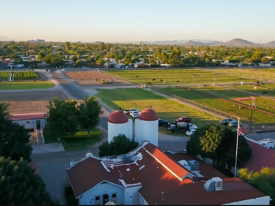 Bird's eye view of Campus Agricultural Center with historic buildings in foreground