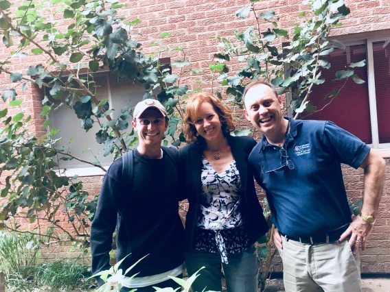 Vice President Burgess pictured near the Shantz Building with a Nutritional Sciences faculty member and student.